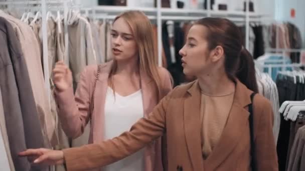 Tracking Shot Young Women Walking Clothes Store Choosing Outfits — Stock Video