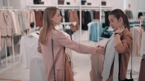 Medium Shot Young Female Friends Talking Choosing Outfits While Shopping — Stock Video