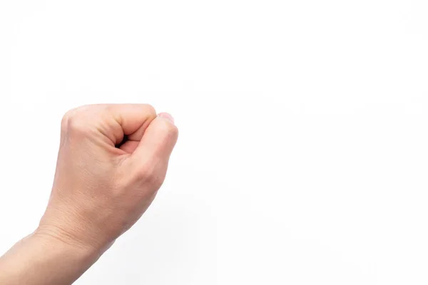 Fisted feszes női kéz fehér alapon — Stock Fotó