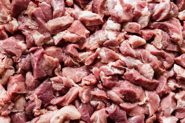 Heap of raw diced beef meat isolated, top view