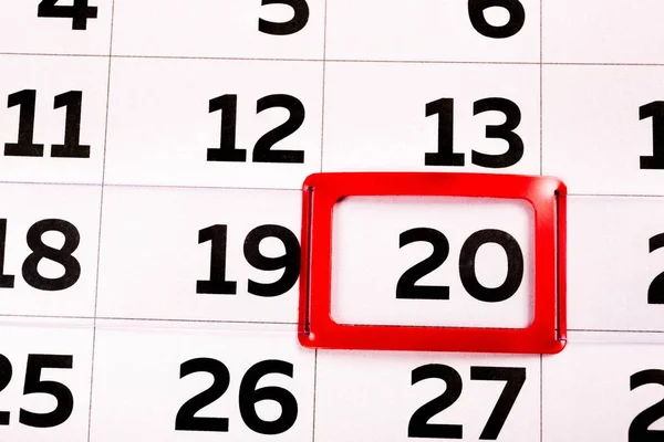 The number 20 on the calendar is highlighted in red. The twentieth day of the month. Agenda for today. Close-up.
