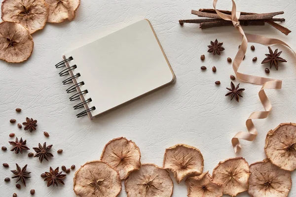 notebook, dried apples on a white background. hygge style