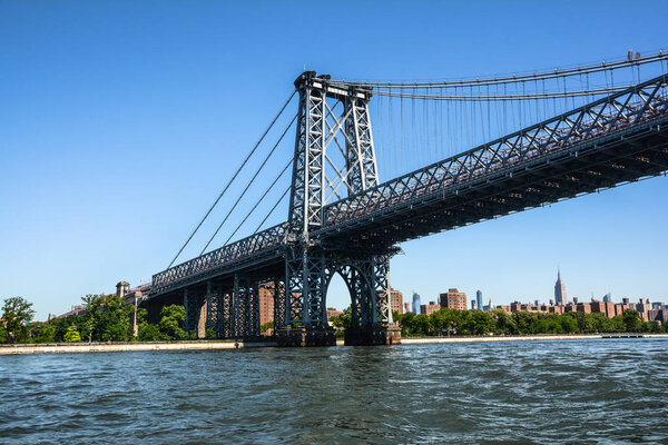 View of the Williamsburg Bridge from the East River, Manhattan, NYC