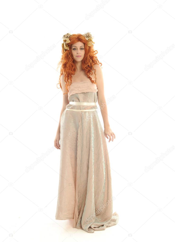 full length portrait of pretty red haired lady wearing fantasy toga gown, standing pose on white background.