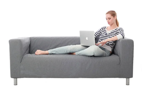 Full Length Portrait Girl Sitting Grey Couch Isolated White Studio — Stock Photo, Image
