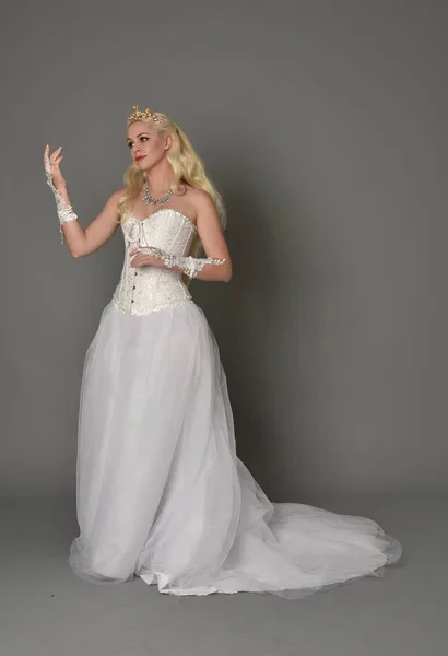 Full Length Portrait Blonde Girl Wearing Torn Ripped Old Bridal Stock Photo  by ©faestock 385846948