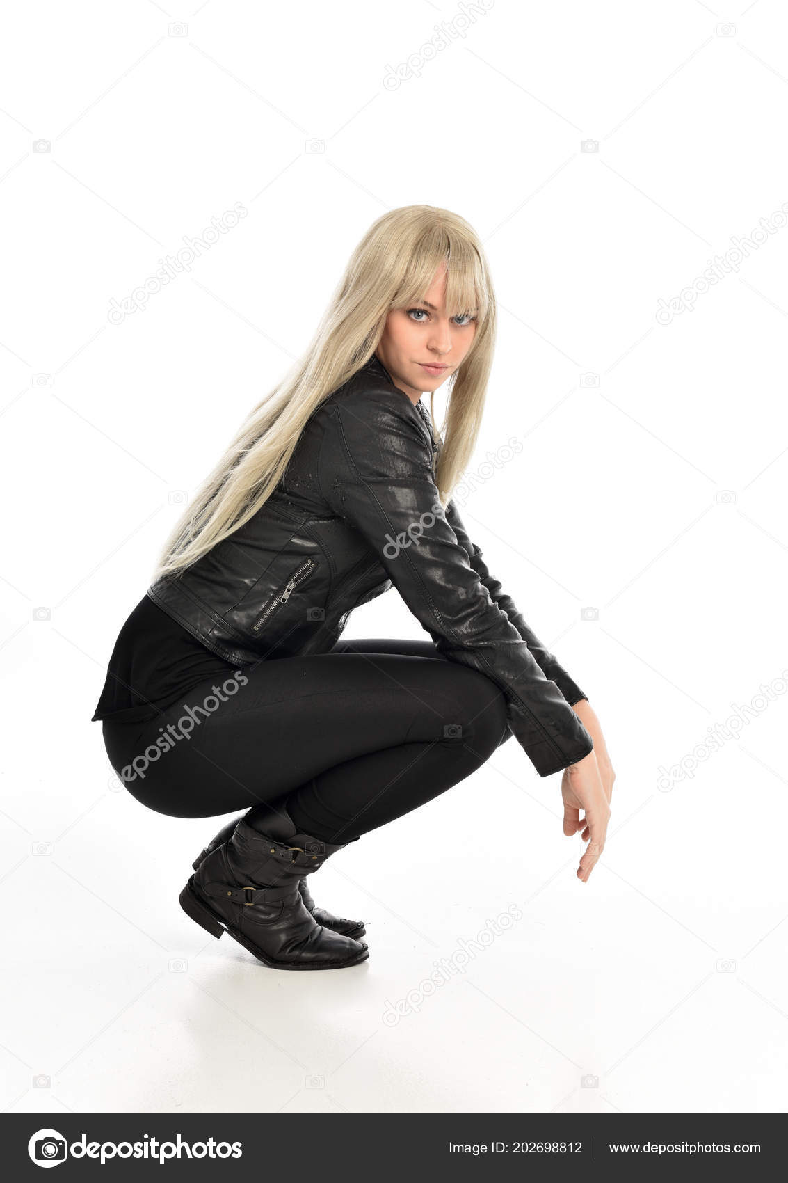 Full Length Portrait Blonde Girl Wearing Black Leather Outfit Sitting Stock  Photo by ©faestock 202698812