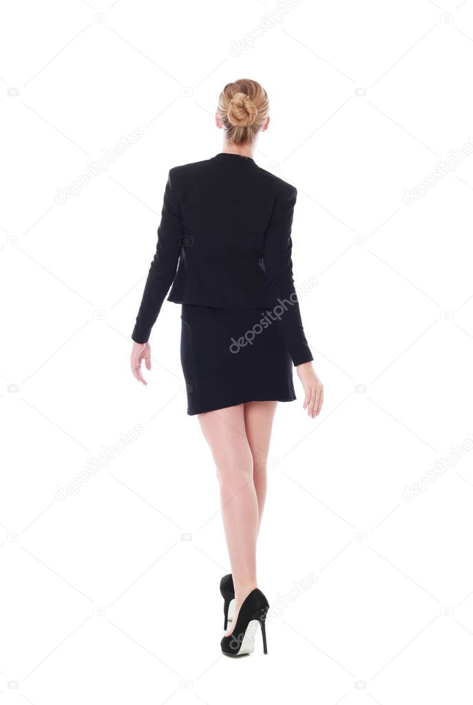 Full length portrait of an attractive professional woman wearing black dress.  isolated on a white background.