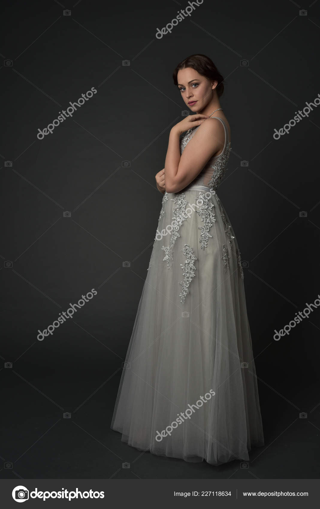A Young Woman in an Airy Dress with Sleeves and Beige Shoes Poses Against  an Background. a Beautiful Brunette Stock Image - Image of grace, gorgeous:  225111319