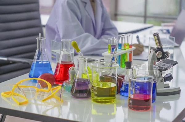 Chemists work lab in the morning,With test pieces working with colorful liquid chemicals, glass tubes,For cosmetics,develop safe recipes for consumers.