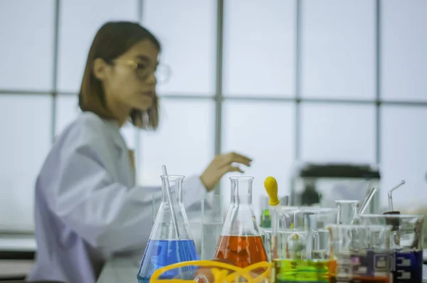 Chemists work lab in morning, With test pieces working with colorful liquid chemicals,Glass tubes,  for cosmetics,develop safe recipes for consumers.