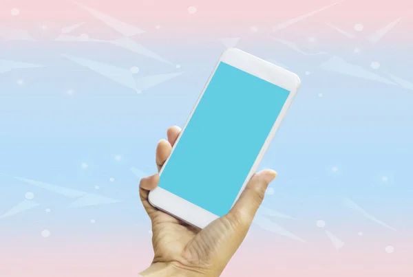 Women holding smartphone in hands with blue screen on bright blue-pink pastel background. With concept of technology and simplicity and convenience,with empty copy space and for text and image — 스톡 사진