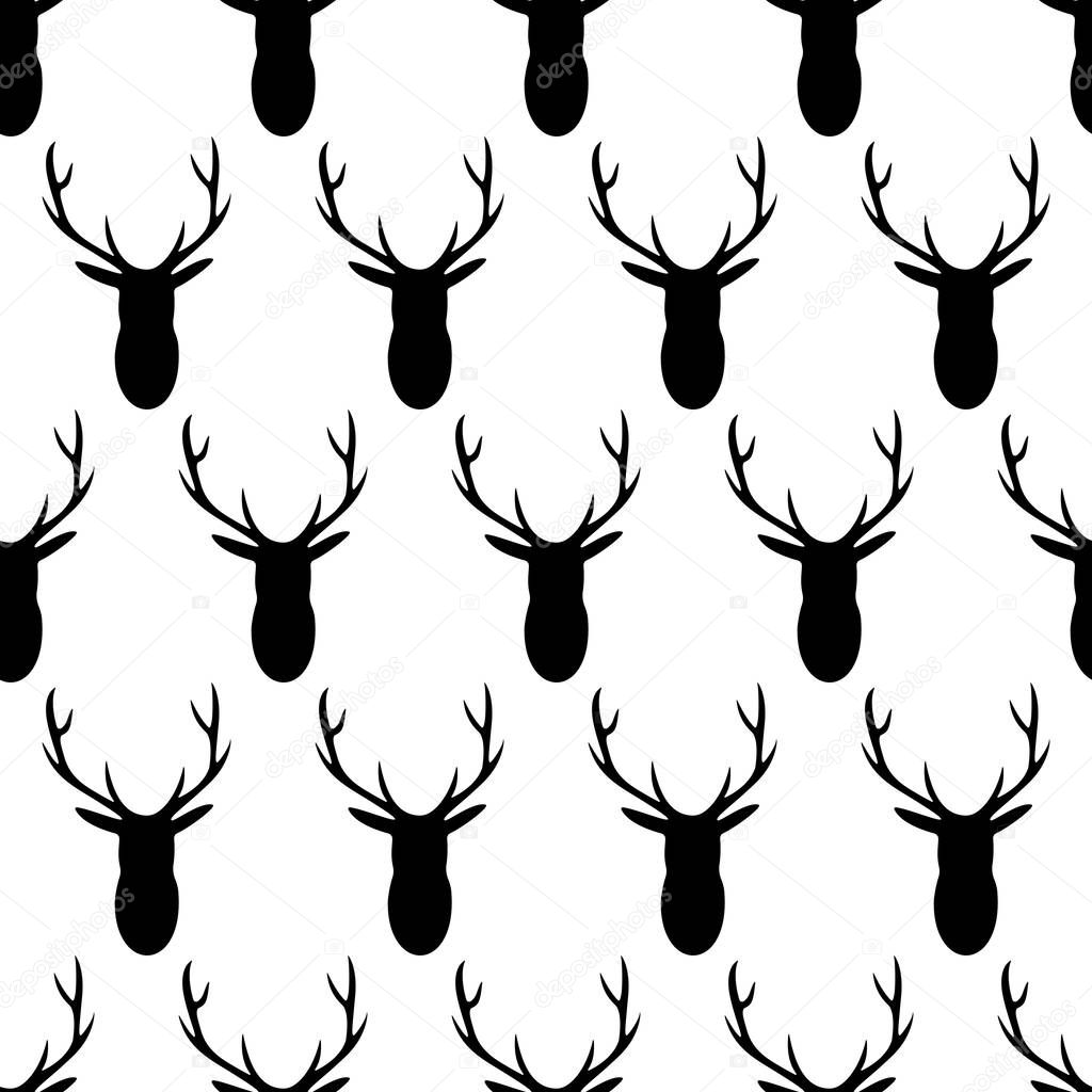 Vector seamless pattern of black deer heads with antlers on a white background. Monochrome pattern great for fabric and wallpaper.