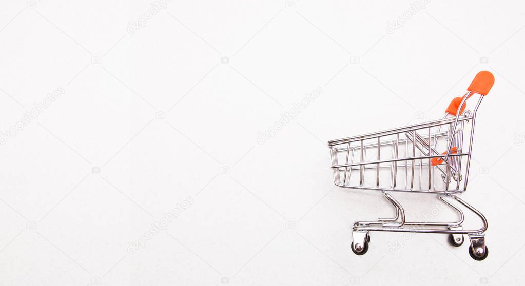 shopping trolley on white background with some copy space.