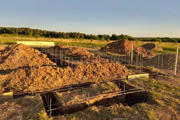 Wooden formwork concrete strip foundation for a cottage — Stock Image Wooden formwork concrete strip foundation for a cottage Royalty Free Stock Images