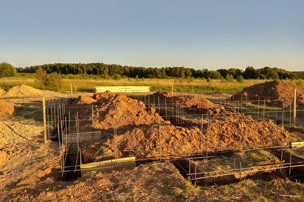 Wooden formwork concrete strip foundation for a cottage — Stock Image Wooden formwork concrete strip foundation for a cottage Stock Picture