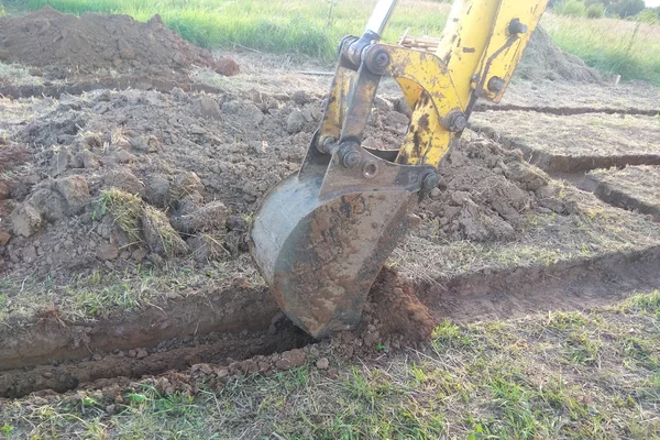 Work of excavating machine on building construction site 2018