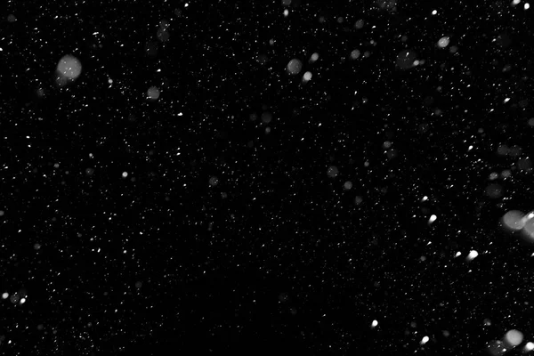 Bokeh beyaz kar bir siyah gece arka planda 2018