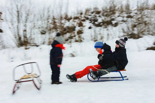 Two Boys Descend Sledges Girl Awaits Them Movement Visible 2019 — стоковое фото