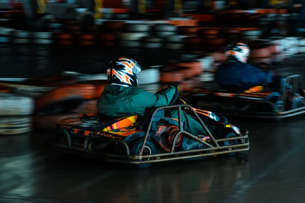 Dynamic karting competition at speed with blurry motion on an equipped racecourse — Stock Photo, Image