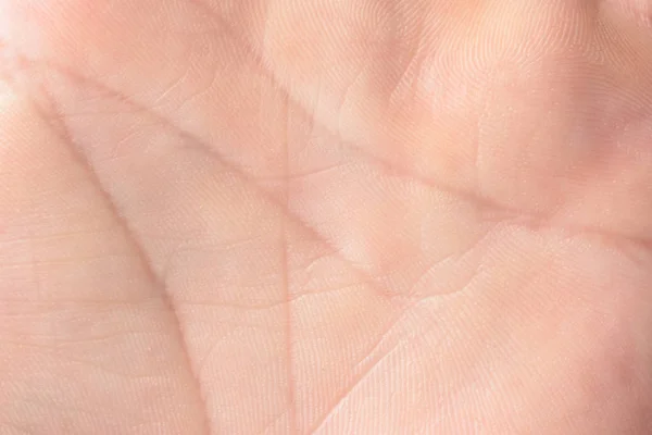 Imagen macro de cerca de la textura superficial de la piel de las palmas de las manos humanas — Foto de Stock