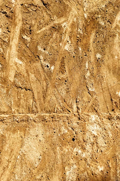 The imprint on a concrete is a texture of wooden plywood orange-yellow color — Stock Photo, Image