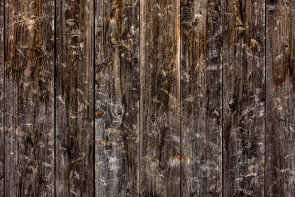 L'aspetto di una parete di legno dalle tavole, una bella texture, un villaggio . — Foto Stock