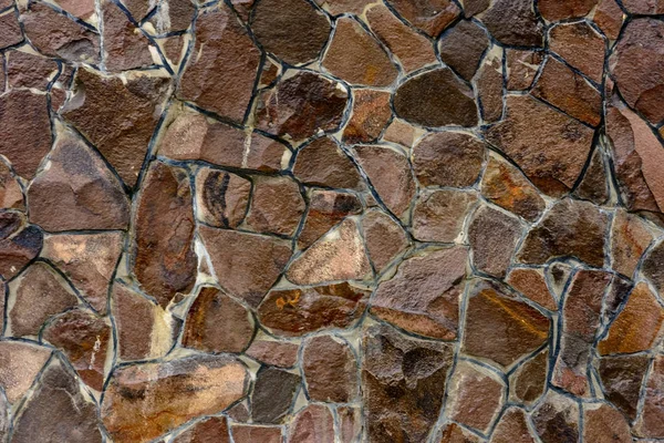 The wall is decorated with decorative stones, original texture and background image. — Stock Photo, Image