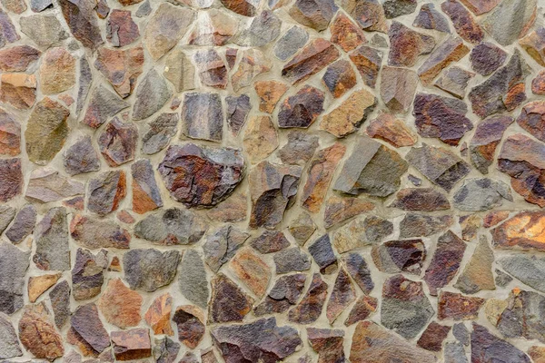 The wall is decorated with decorative stones, original texture and background image. — Stock Photo, Image