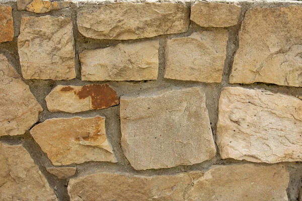 The wall is decorated with stone stones, beautiful texture. — Stock Photo, Image