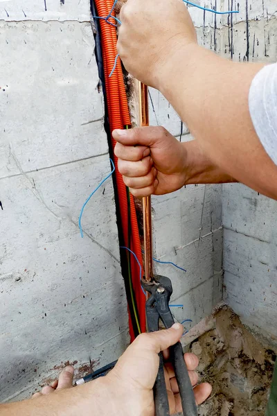 Connection of a copper tube for grounding of the electric shock-proof device in an apartment house.