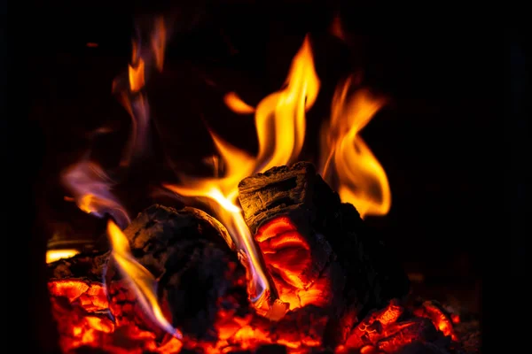 Fire is red in a closed oven on black background. — Stock Photo, Image