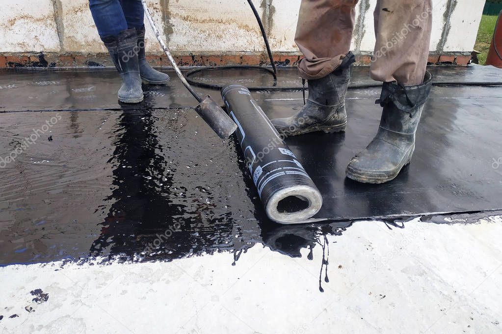 Worker covered surface, bitumen primer for improving adhesion during surfacing, rolled waterproofing, during the installation of isolation on industrial or household objects.