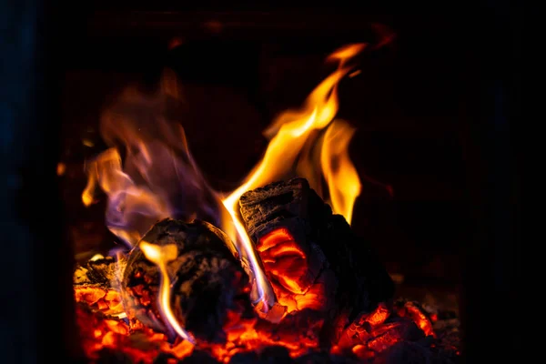 Fire is red in a closed oven on black background. — Stock Photo, Image