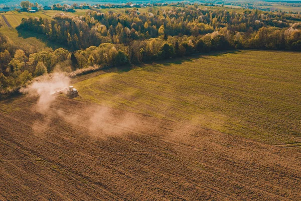 The process of preparing the land for sowing cultivated plants, view from the top of the field cultivation process, Ukrainian fertile lands.2021