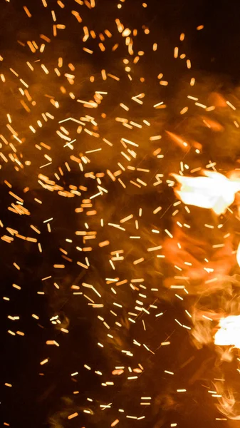 close up of sparks from fire, sparks on black background, extravaganza of fire, magic with sparks.2020