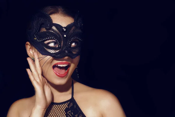 The girl in the mask. Masquerade, halloween. Girl in a cat mask.