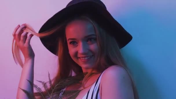 Girl Neon Light Hat Dances Tropical Leaves Summer Concept Parties — Stock Video