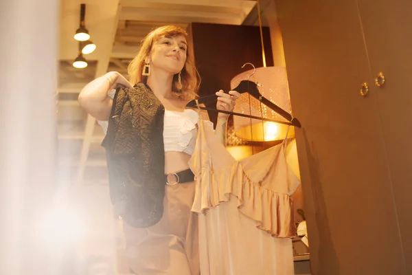 Woman Looks Mirror Chooses Dresses Girl Going Date What Better — Stock Photo, Image