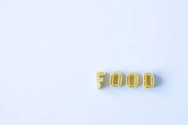 Das Wort Essen Das Mit Echten Nudelbuchstaben Auf Einer Weißen — Stockfoto