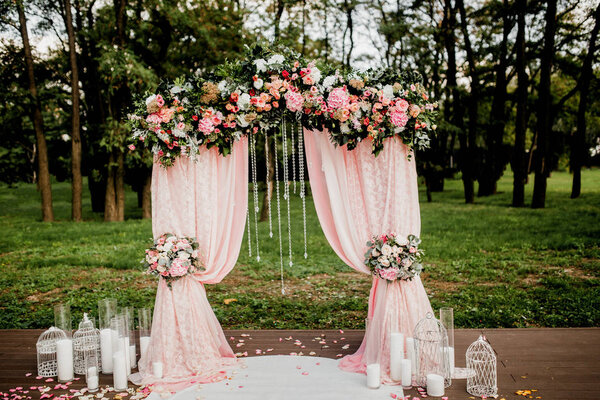 beautiful   decoration for  wedding ceremony with flowers and candles