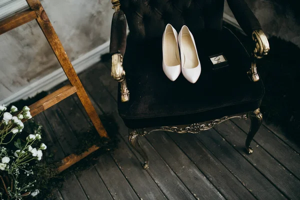 fashionable female Wedding shoes on chair, close up