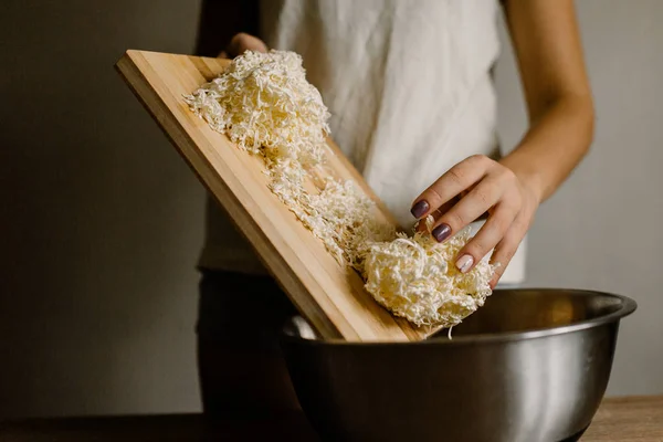 Woman Adding Grated White Butter Cheese Cake Wooden Table — Stock Photo, Image