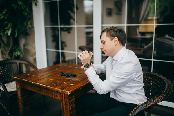 young handsome caucasian wearing watch