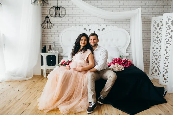 Wonderful married couple posing in bedroom