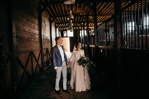 happy couple of young  newlyweds on ranch