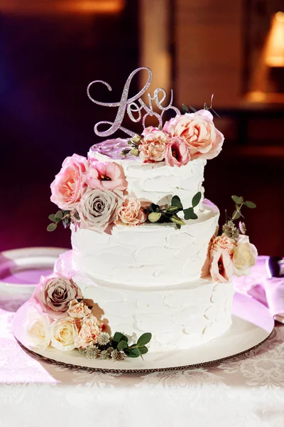 beautiful wedding cake with  flowers, close up
