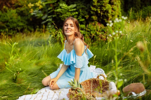 beautiful   woman having picnic  in garden.