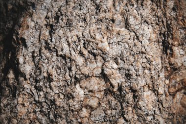 Yakın çekim taş küçük parlak ve parlak keskin rock yüzey detay dokulu. Doğal grunge arka plan.