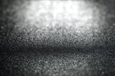 Yüzey doku odaklanmış ile soyut siyah parlak arka plan ve ön plan ve arka plan bulanık bokeh alanı